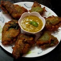 A picture of Stuffed Bottle gourd leaves.