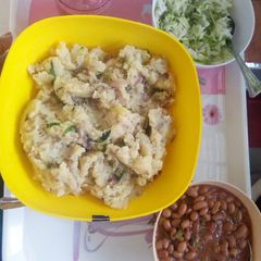 A picture of Mashed potatoes, beans & steamed cabbage dinner.