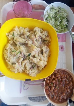 A picture of Mashed potatoes, beans & steamed cabbage dinner.