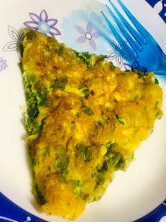 A picture of Spinach omelette soufflé with spring onions.