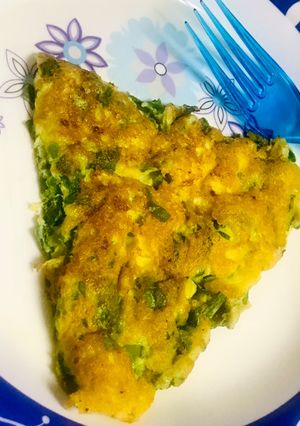 A picture of Spinach omelette soufflé with spring onions.