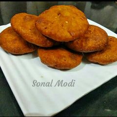A picture of Banana Toddy puri with stuff chanadal.