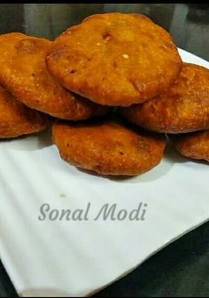 A picture of Banana Toddy puri with stuff chanadal.