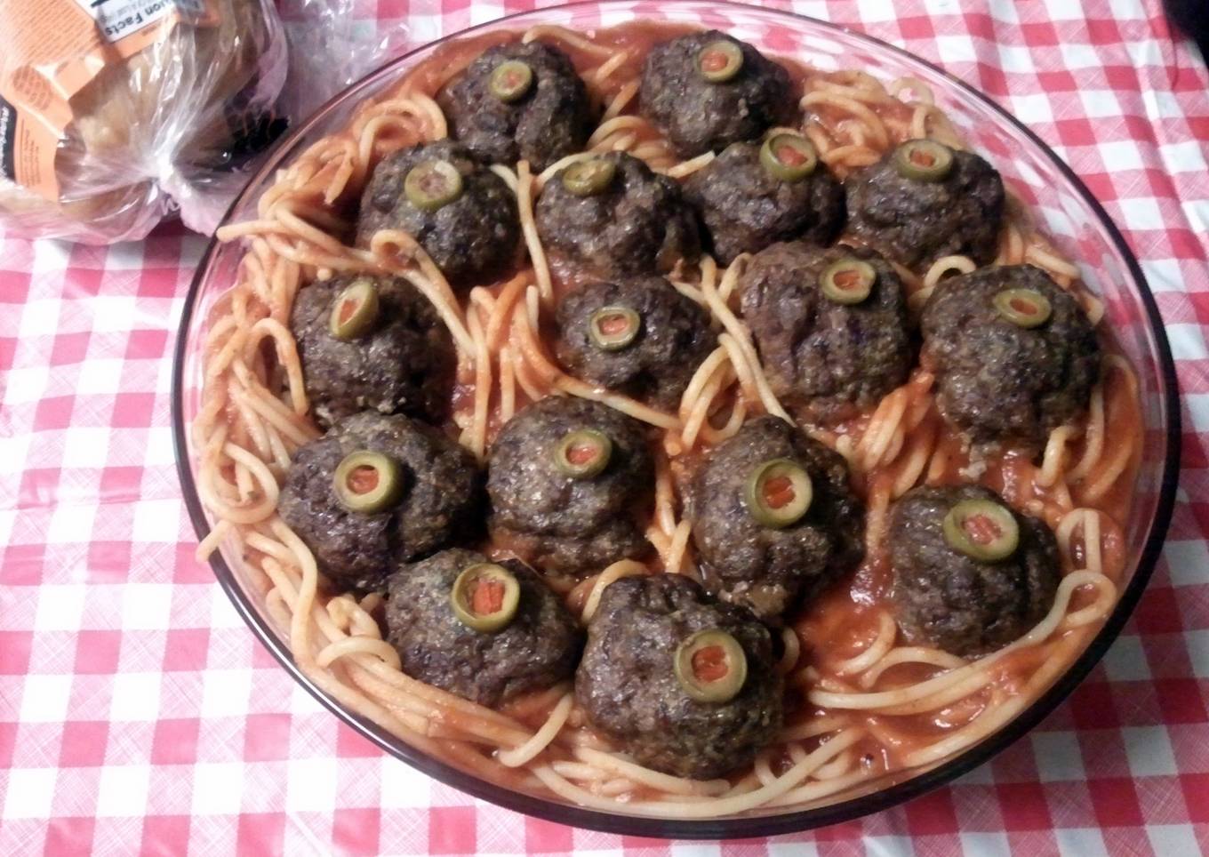 Halloween eyeballs in worms (spaghetti and meatballs)