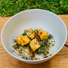 A picture of Crispy Tofu with Brown Sushi Rice and Seaweed.