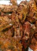 Deep fried Turkey wings smothered an covered in roasted garlic gravey.  Recipe by Brittney J - Cookpad