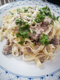 A picture of Tagliatelle with Porcini Mushrooms, Sausage, and Cream.