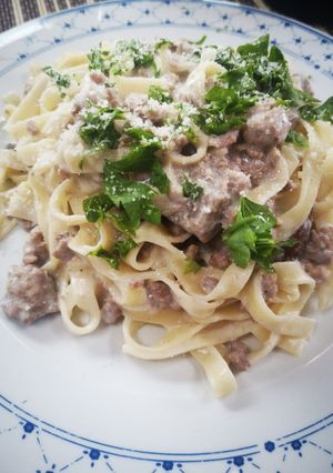 A picture of Tagliatelle with Porcini Mushrooms, Sausage, and Cream.