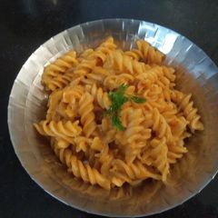 A picture of Pink and white sauce pasta.