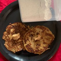 A picture of Healthy pancake premix with pancakes topped with peanut butter.