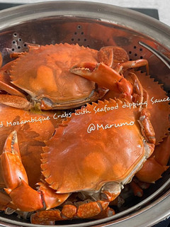 A picture of Steamed Mozambique Crabs with Seafood dipping Sauce.