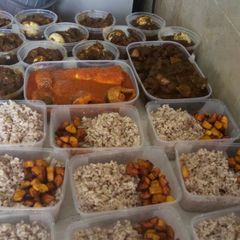 A picture of Ofada rice,fried plantain and ayamase sauce.