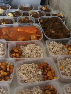 A picture of Ofada rice,fried plantain and ayamase sauce.
