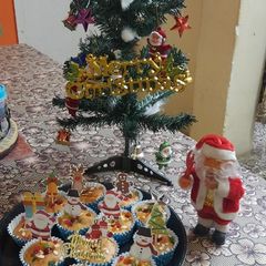 A picture of Christmas special vanilla tutti fruti cup cakes.