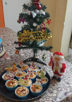 A picture of Christmas special vanilla tutti fruti cup cakes.