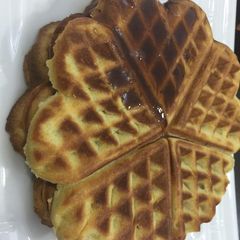 A picture of Vanilla waffles glazed with honey.
