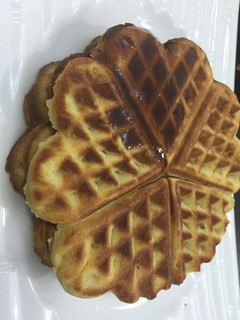 A picture of Vanilla waffles glazed with honey.