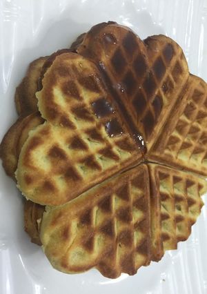 A picture of Vanilla waffles glazed with honey.