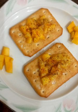 A picture of Tuc with mango chunks 🥭.