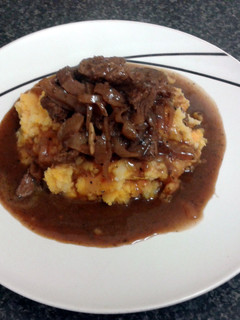 A picture of Beef in Red wine & shallott gravy served on sweet potato mash.