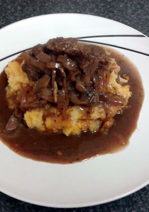 A picture of Beef in Red wine & shallott gravy served on sweet potato mash.