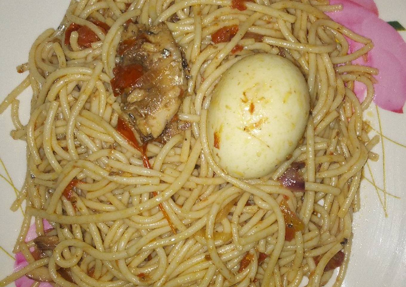 Spaghetti jollof with sardine and egg