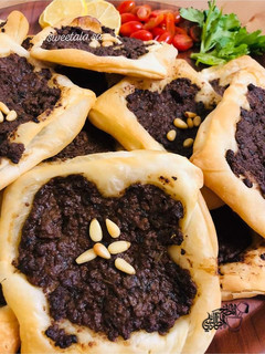 A picture of Tripolitan meat pies (lahmeh baajin).