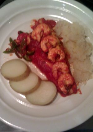 A picture of seabass & prawn with tomato, garlic & paprika sauce with coin potatoes, onion & turnip mash..