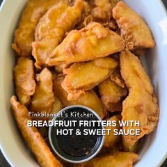 A picture of Breadfruit fritters with hot & sweet sauce.