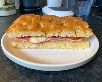 Without Fail Serving Recipe Focaccia bread with Mortadella grilled tomatoes melted mozzarella and cornichons Delicious and Healthy