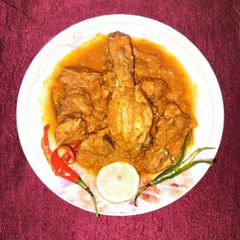 A picture of Kashmiri chilli gandharaj lemon chicken curry.