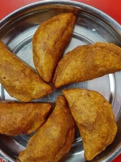 ভাজা পুলি পিঠে (bhaja puli pithe recipe in bengali) রেসিপির প্রধান ছবি