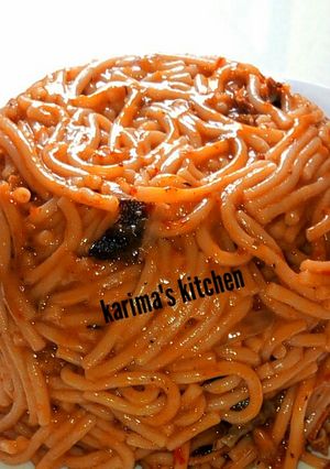 A picture of Jollof pasta with dry fish.