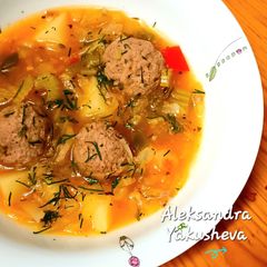 A picture of Vegetable stew with meat balls.