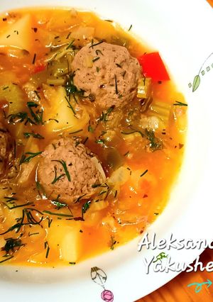 A picture of Vegetable stew with meat balls.