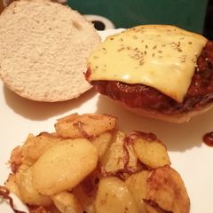 A picture of Burgers patties in spicy tomato sauce.