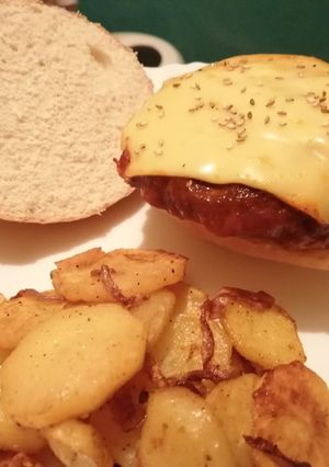 A picture of Burgers patties in spicy tomato sauce.