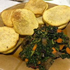 A picture of Fried yam and vegetables.