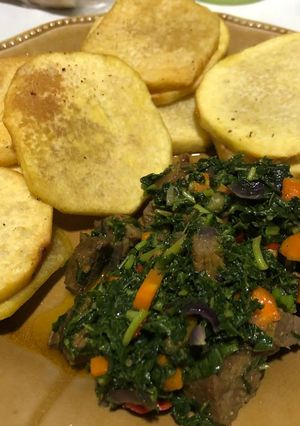 A picture of Fried yam and vegetables.