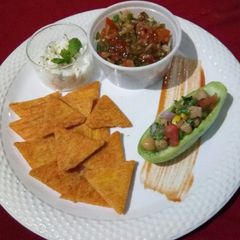 A picture of Tangy Salsa with multi grain nachos.