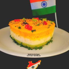 A picture of Heart Shaped 3 Layers Tricolor Dhokla Savory Cake - 80th Independence Day Special.