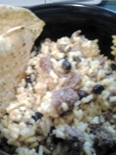 A picture of yellow rice & ground beef.