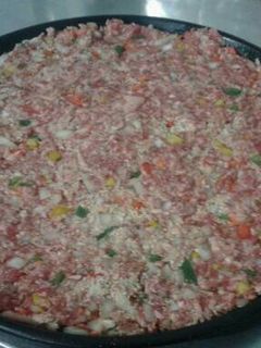 Una foto de Hamburguesa gigante a la pizza