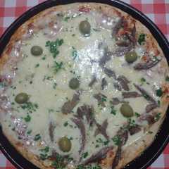 Una foto de Pizza de asadito