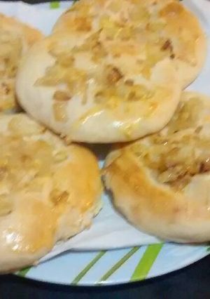Una foto de Pan casero con cebolla y muzzarella