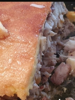 Una foto de Merluza rellena con costra de mahonesa