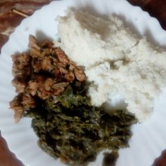 A picture of Pork with ugali.