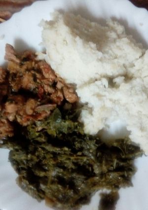 A picture of Pork with ugali.