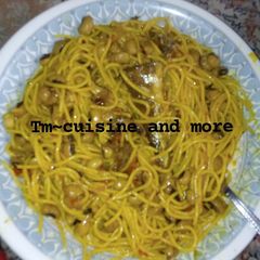 A picture of Jellof spaghetti and beans.