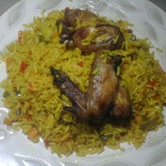 A picture of Fried rice& chicken wings...#Abujamoms.